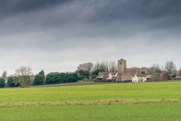A view of Great Stukeley church over open green fields